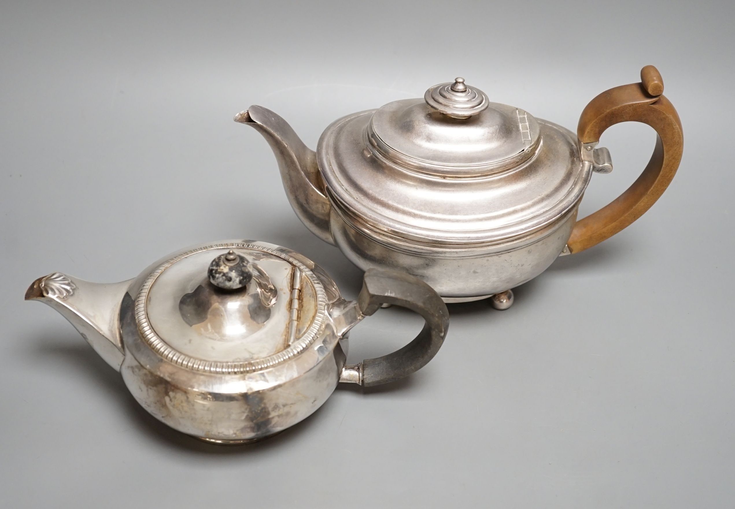 A George III silver teapot, Soloman Hougham, London, 1816 and a 20th century squat silver teapot, gross 31.5oz.